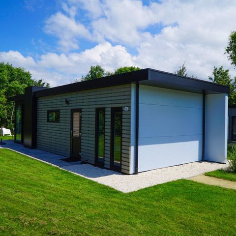 Lodge 4 personnes - Digue avec jacuzzi et sauna