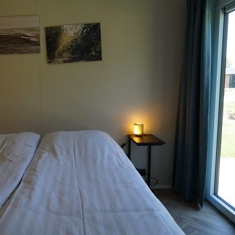 Lodge 4 personnes - Digue avec jacuzzi et sauna