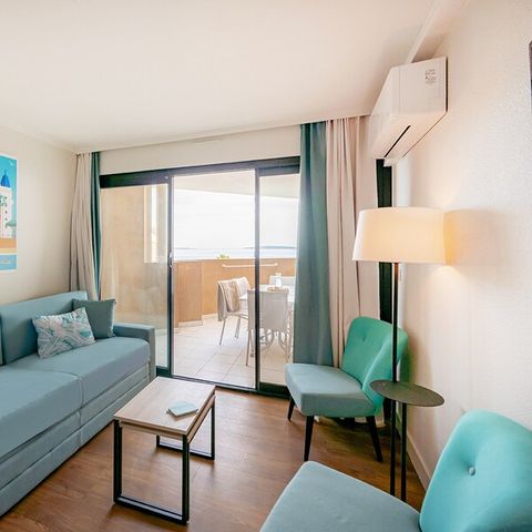 Appartement 6 personnes - 1 chambre - 1 coin - Nuit - Vue mer - Climatisation - Terrasse ou balcon